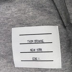 Thom Browne. Gray hoodie. Size 1. Never been worn and in original packaging.